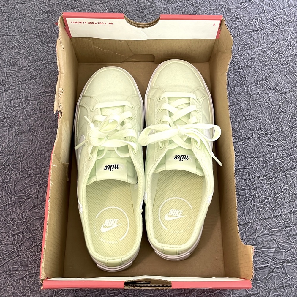 Woman’s 6.5, lime green slip on Nikes